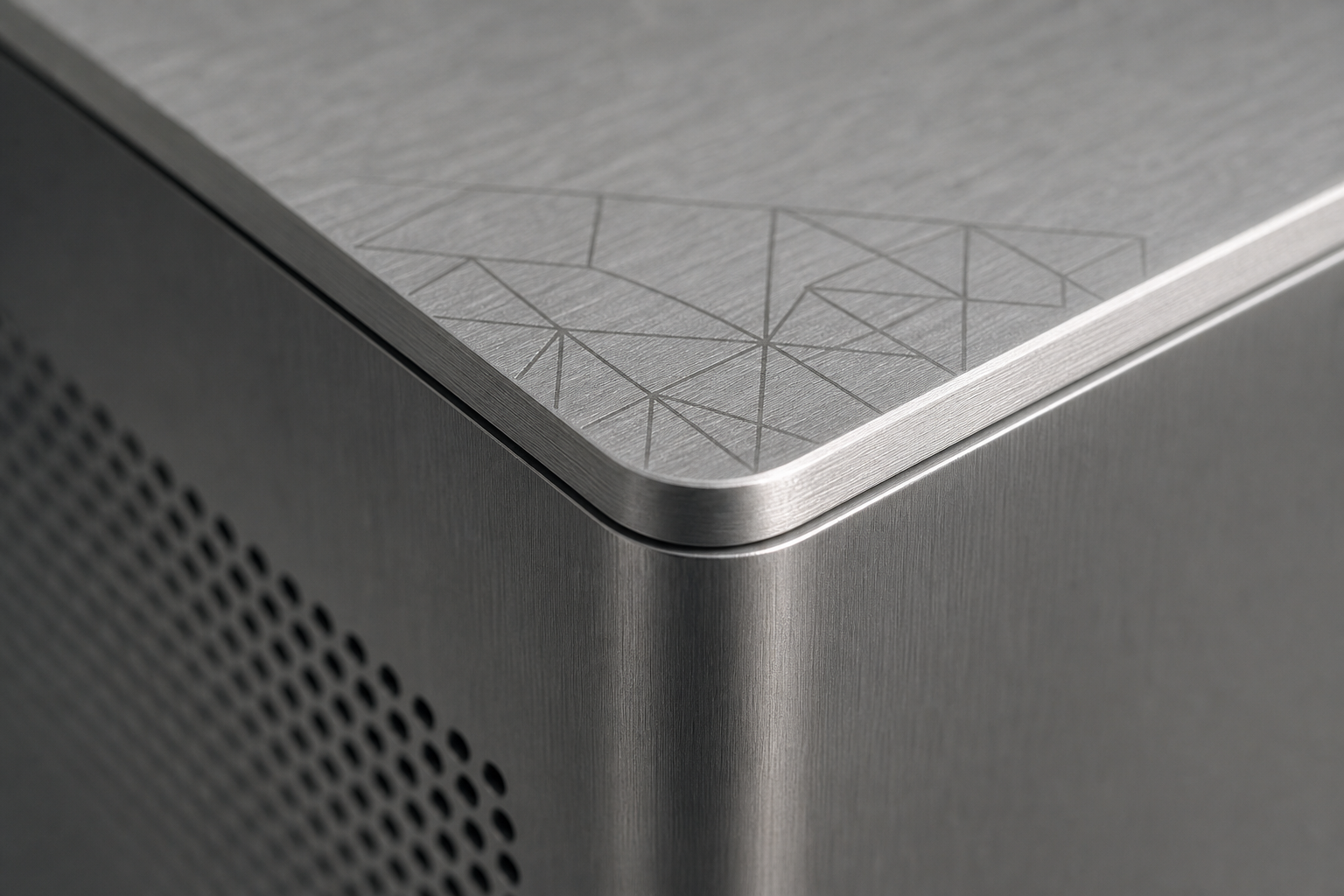 Close-up of a finished aluminum case corner with subtle engraving